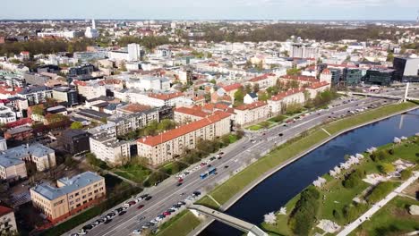 Busy-street-and-downtown-of-Kaunas-city,-aerial-panoramic-view