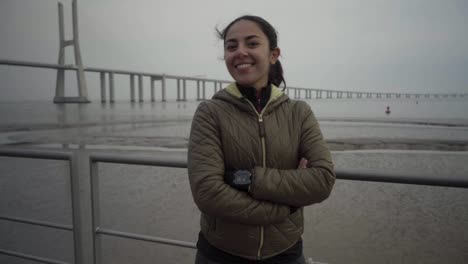 Smiling-hindu-woman-posing-with-crossed-arms-at-seaside