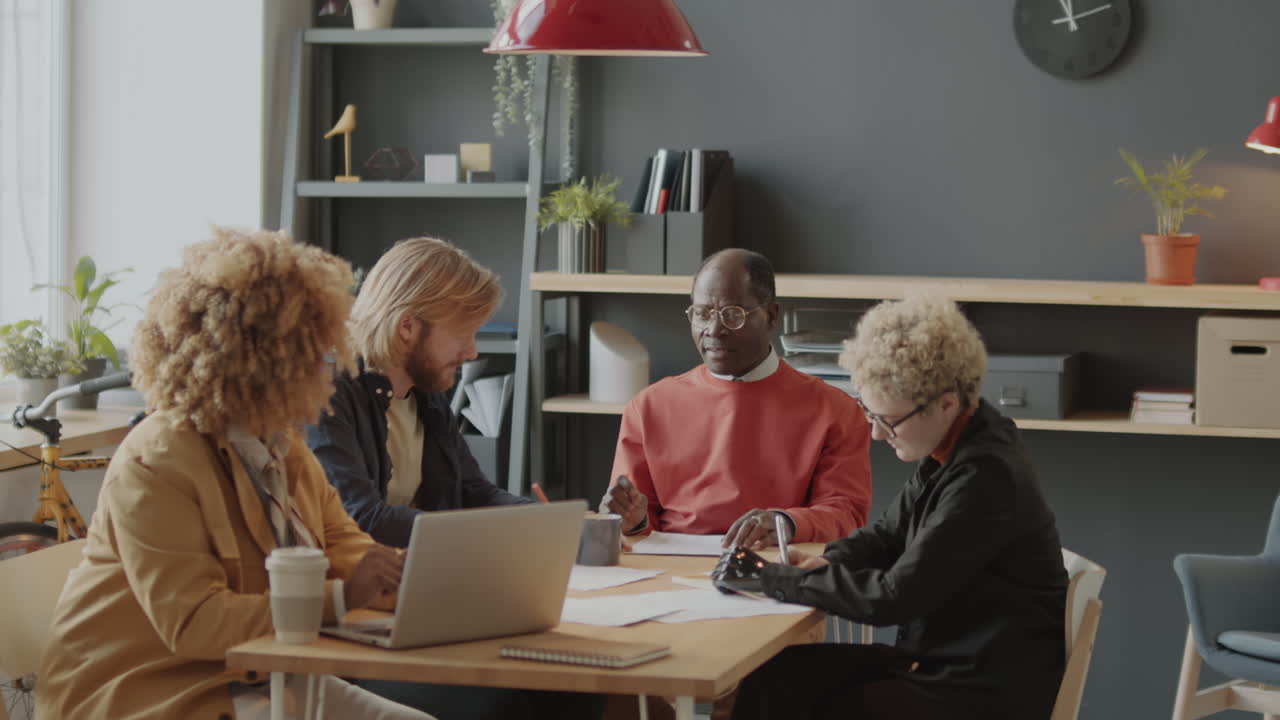 Diverse Group of Professionals Collaborating in a Modern Office Meeting