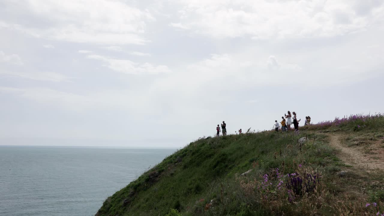 Several Tourists On The Mountain In Cape Kaliakra Nature Reserve, Black Sea Coast, Bulgaria. Wide Shot