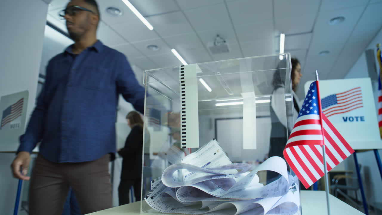 African American Man Puts Ballot Paper in Box after Voting Multiethnic Voters us Citizens Vote for Future President in Voting Booths at Polling Station African American Man Puts Ballot Paper in Box National Election Day in the United States of America