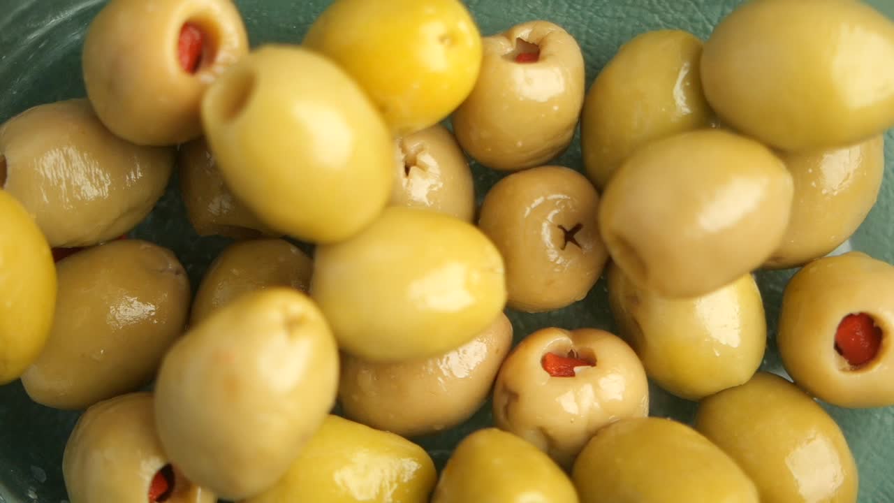 Close-up of a bowl of pitted green olives