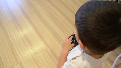 boy-playing-with-the-remote-car