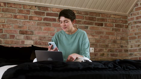 woman doing videocall on the bed