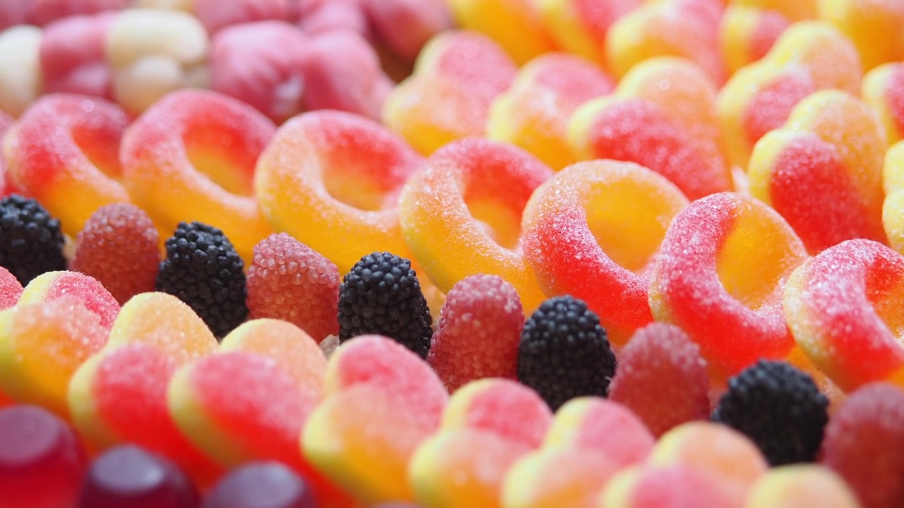 Assorted Colorful Gummy Candies Arranged in Rows