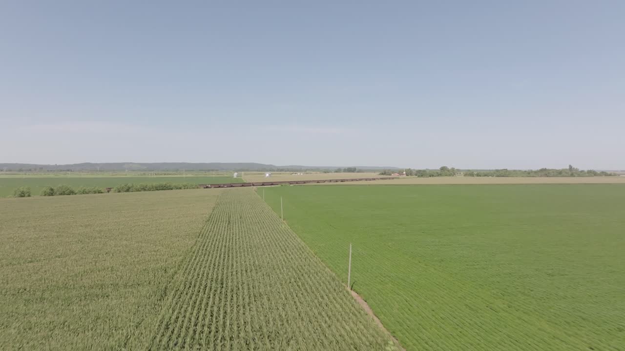 Aerial View of a Train Passing Through Farmland