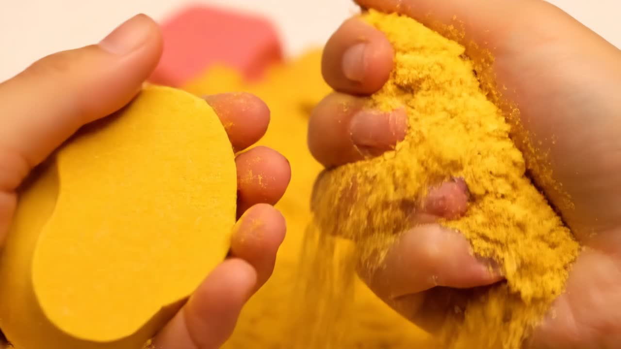 Kinetic sand in hands