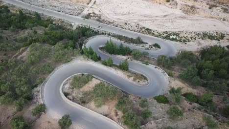 zigzag roads through the mountains of albania on a road trip during the summer