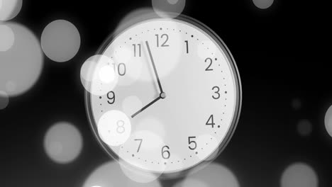 animation of clock ticking over spots of light on black background