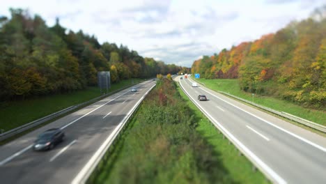 cars driving fast over a german highway in "tilt shift"-effect