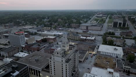 downtown davenport, iowa with drone video moving in a circle at dusk