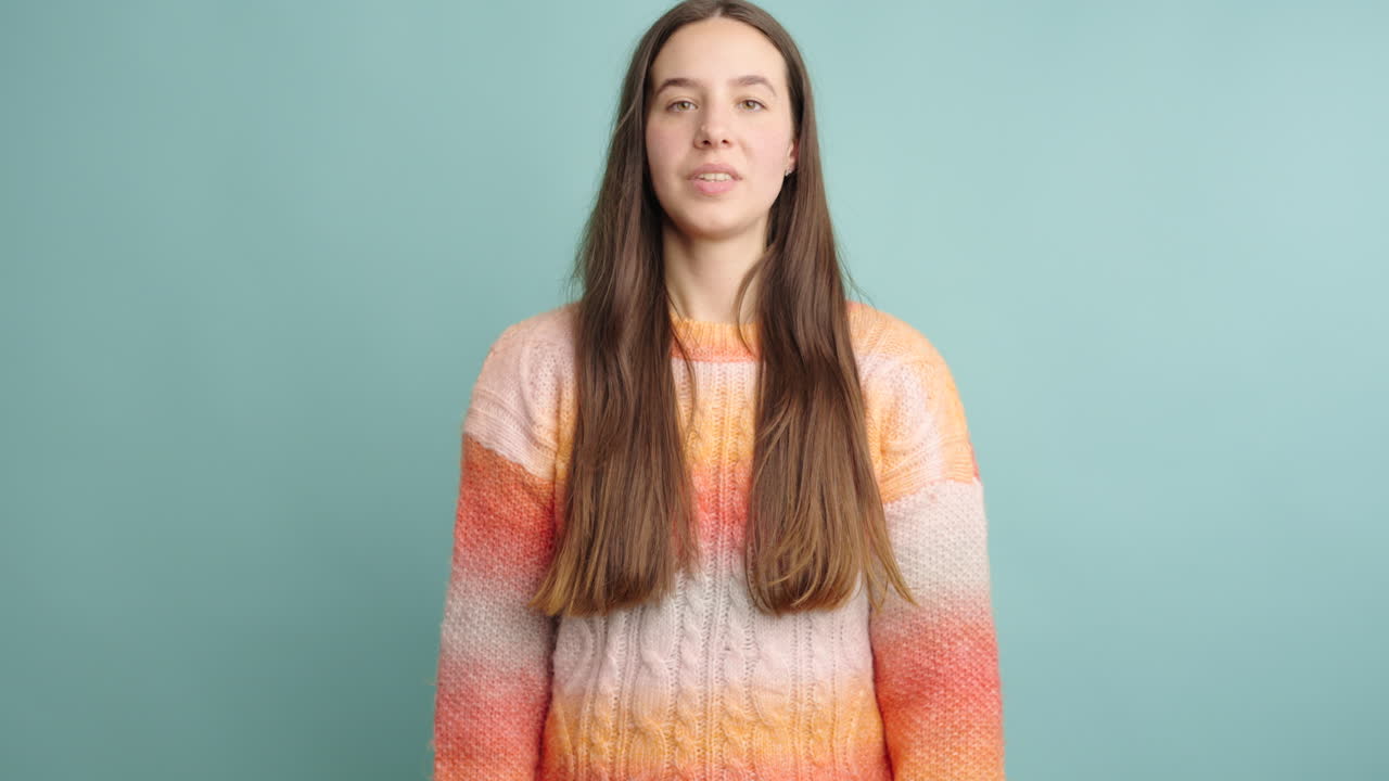 Expressive young woman reacting with joy and surprise