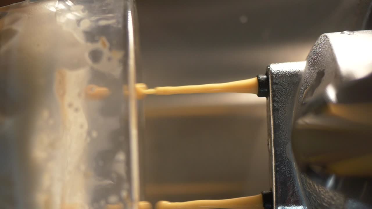 Espresso pouring into a glass