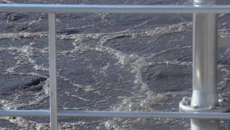 close-up of an aeration basin with flowing water during wastewater treatment, symbolizing purification and renewal, dominated by blue and gray hues.