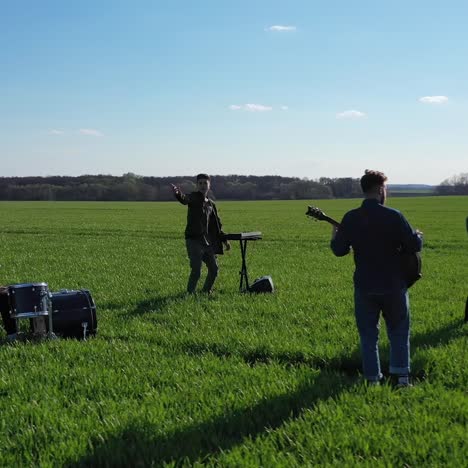 musical group playing outdoors. young band playing concert on field
