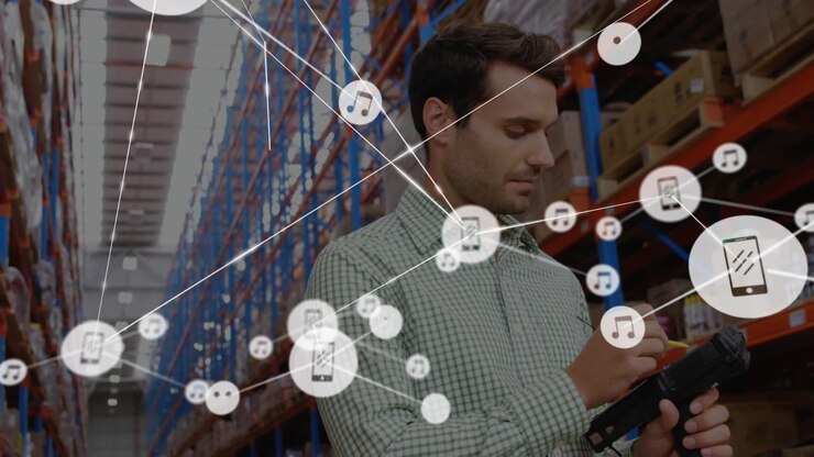 Animation of network of connections with icons over man working in warehouse