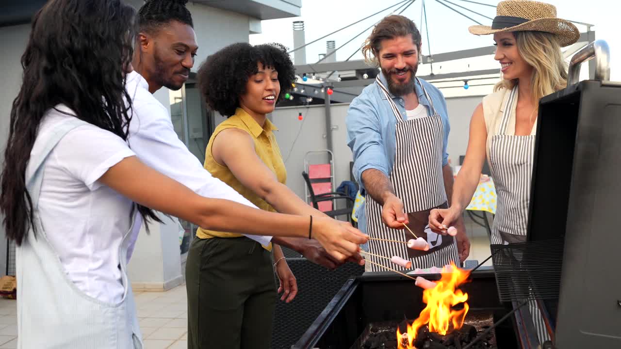 Friends grilling sausages at a rooftop barbecue party
