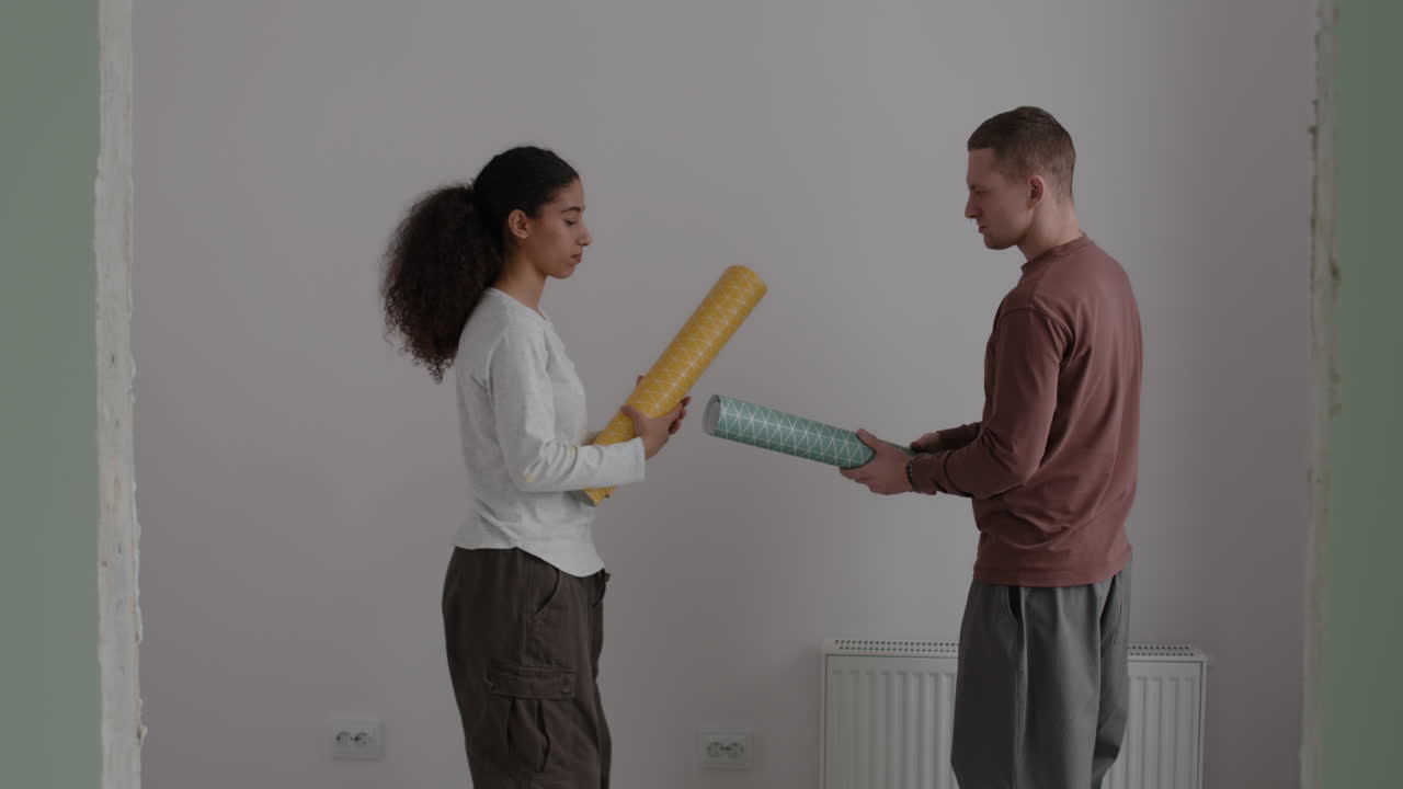 Couple Choosing Wallpaper for Home Renovation