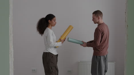 couple choosing wallpaper for home renovation