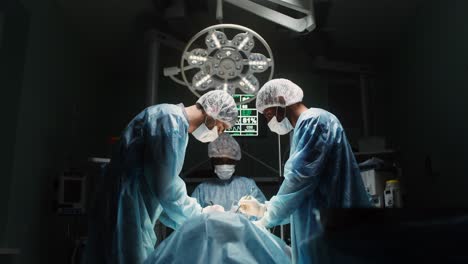 surgeons performing surgery in an operating room