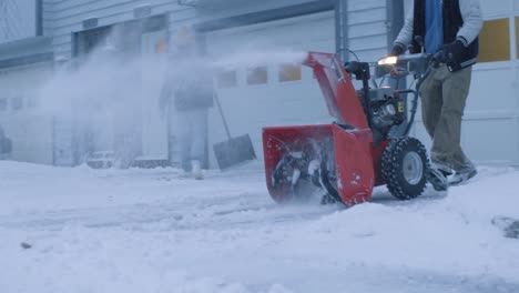 Two-Plowmen-removing-snow-at-residential-area---day