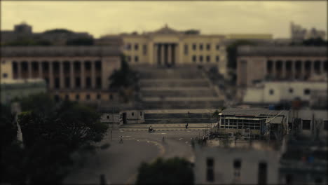 bus and a red car and pedestrians commuting in a city. tilt and shift, stop motion, miniature world.