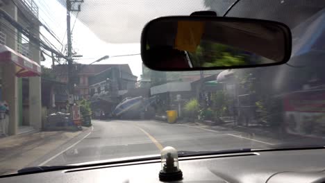 view from the cab of the car on the city road.