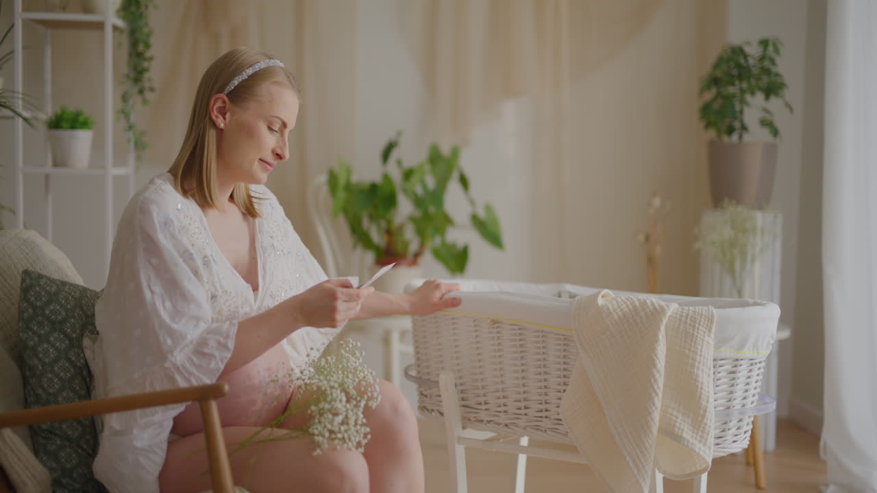 Pregnant Woman Singing Lullaby to Baby