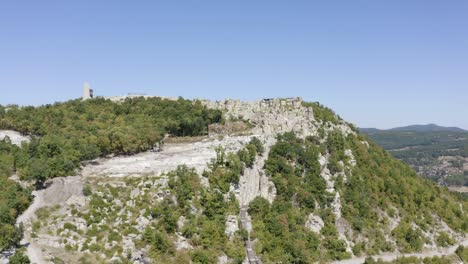 approaching drone shot of the ancient historical landmark of perperikon, built on a rocky hilltop, located in the province of kardzhali in bulgaria