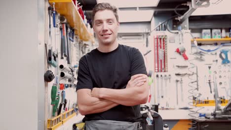 cheerful man in bicycle repair workshop