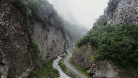 misty mountain road through a canyon