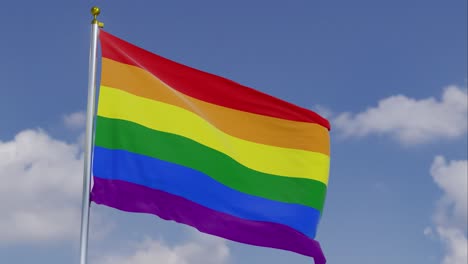 bandera del orgullo del arco iris moviéndose en el viento con un cielo azul claro en el fondo, nubes moviéndose lentamente, asta de la bandera, cámara lenta, lgbt