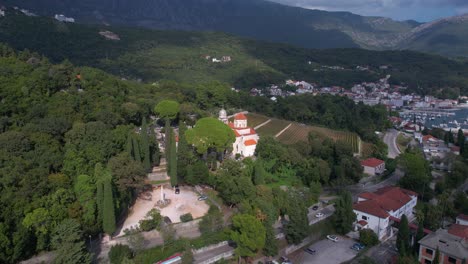 aerial view of savina monastery and green landscape on hill above herceg novi, montenegro