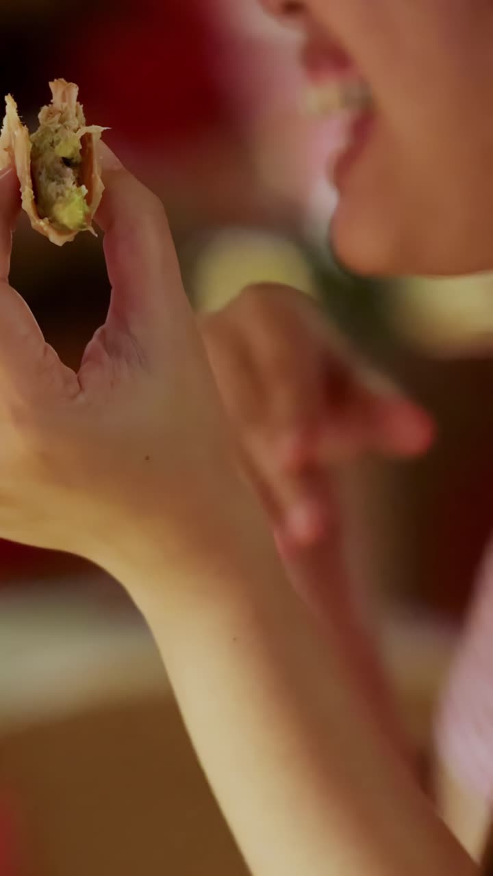 Young woman eats beef taco, laughs, warm lighting, close-up, casual restaurant, candid moment