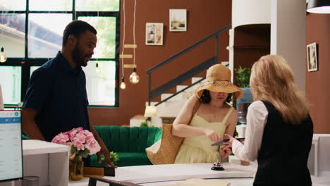 tourists registering at front desk