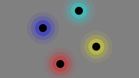 four colorful circles revolving around center axis