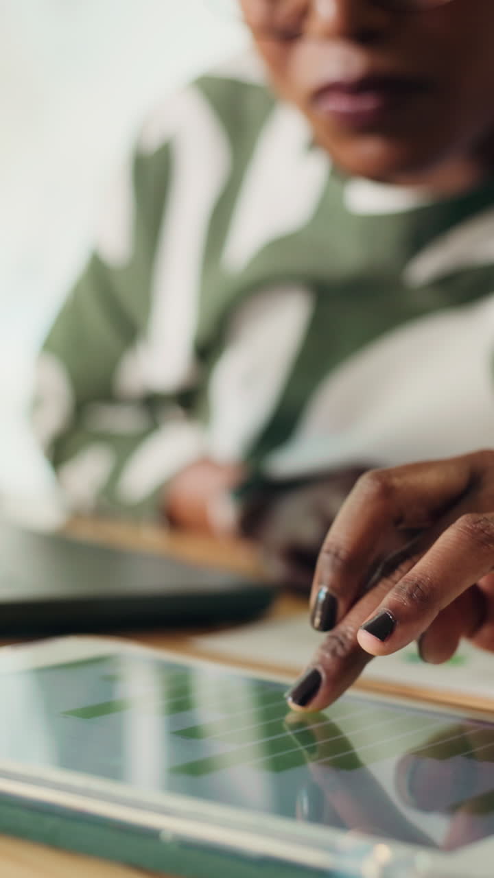 Close Up of Person's Hand Interacting with Digital Tablet Screen