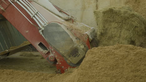 a farming machine scoops up resources to process in it's internal bay