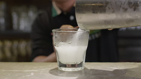 Shot-of-bartender-Preparing-Fresh-Mojito-Drink-on-Bar