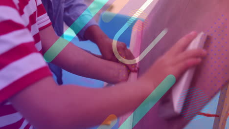 children drawing on chalkboard with colorful shapes animation over scene