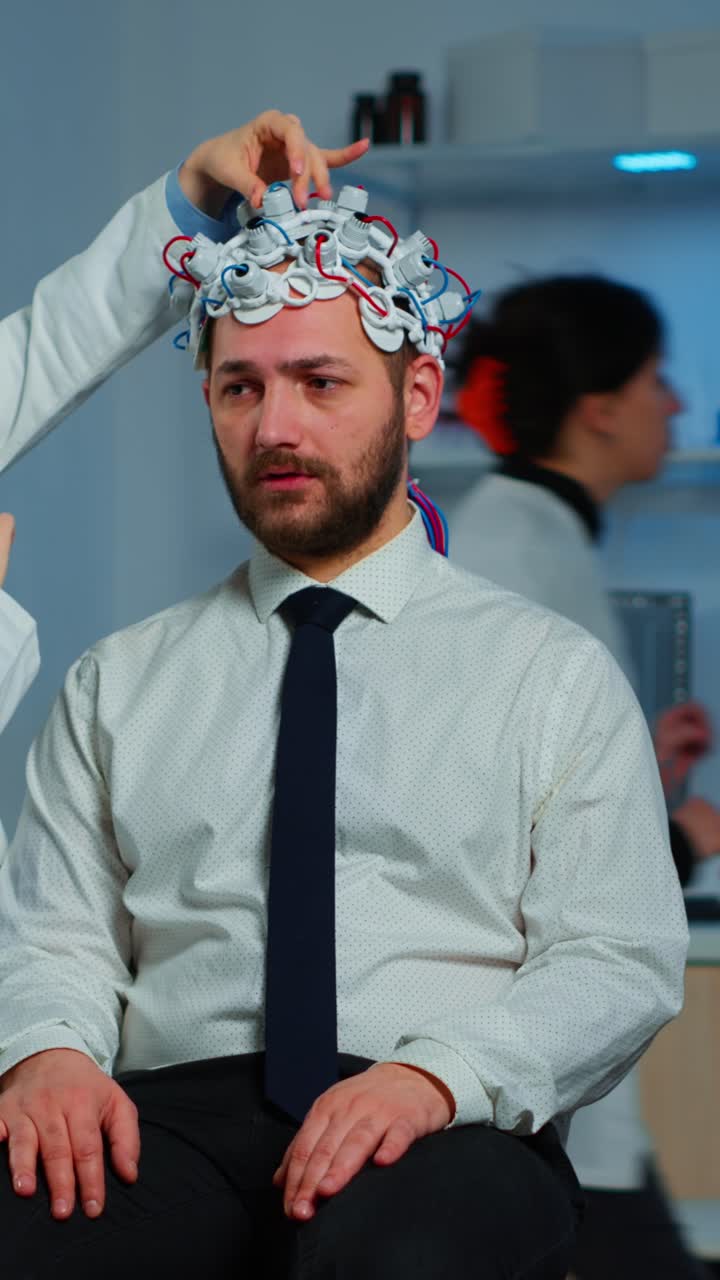 Man Undergoing EEG Brain Scan in a Medical Laboratory