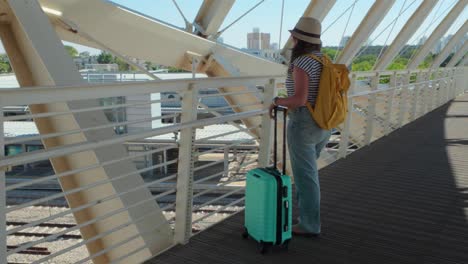tourist looks out before boarding