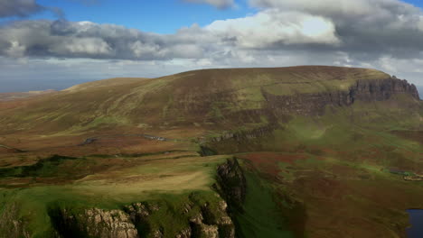 Aerial-View-of-Pristine-Landscape,-Isle-of-Skye-Scotland-UK,-Hills-and-Grassland-Above-Countryside-Lake-on-Sunnu-Day