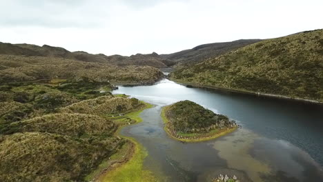 beautiful aerial drone shot over a mountain range and river in south america