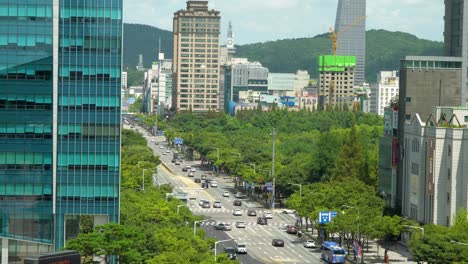 traffic on city road with high-rise buildings in daejeon, south korea