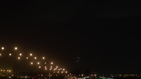 airplane approaching runway night