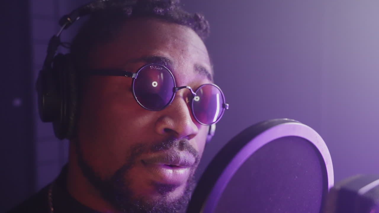 Man Recording Music in a Studio