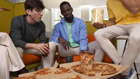 friends enjoying pizza and popcorn during casual hangout