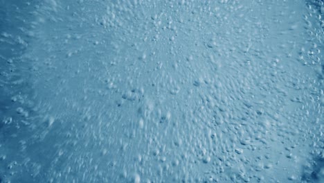 Oxygen-bubbles-in-water-on-a-blue-abstract-background