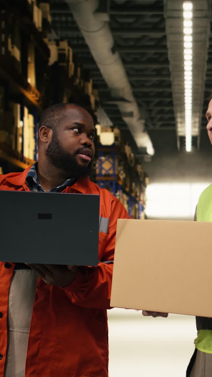 Vertical Video Diverse Colleagues Moving Cargo In Boxes Using Laptop For Inventory Control